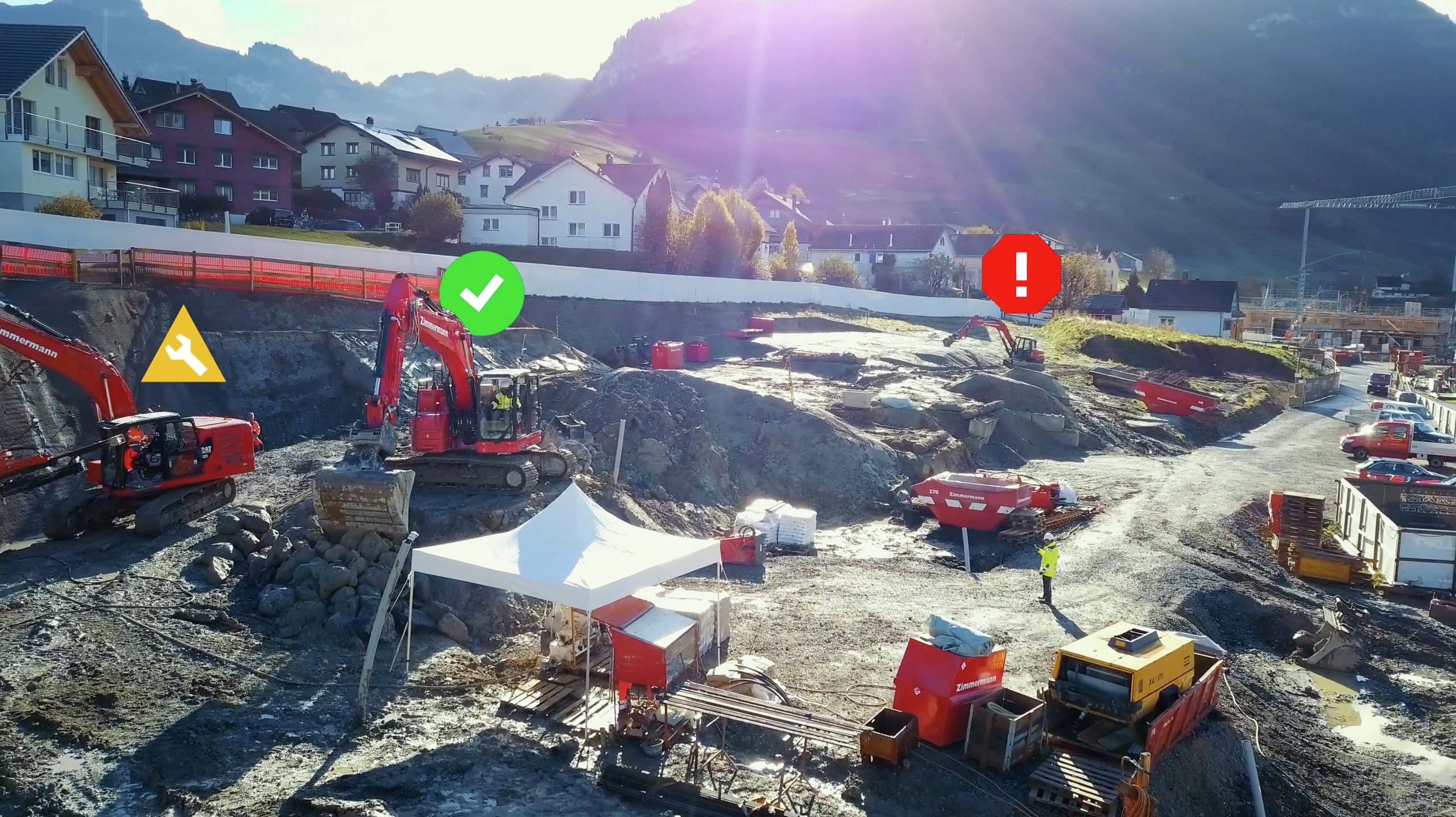 Jobsite with icons over heavy equipment showing their status