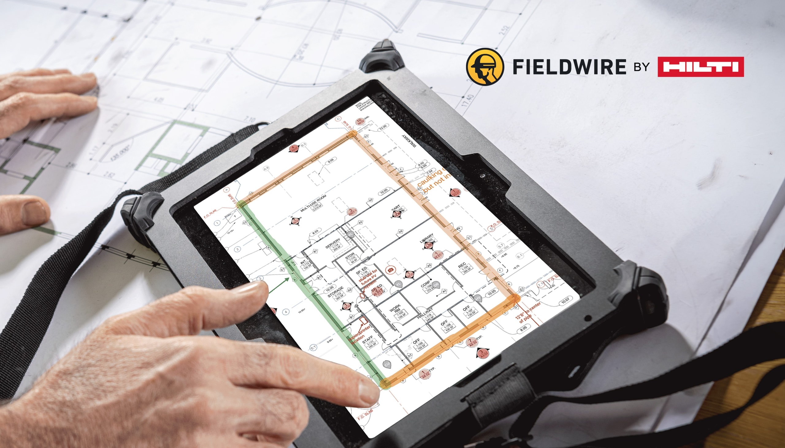 worker checking construction drawings