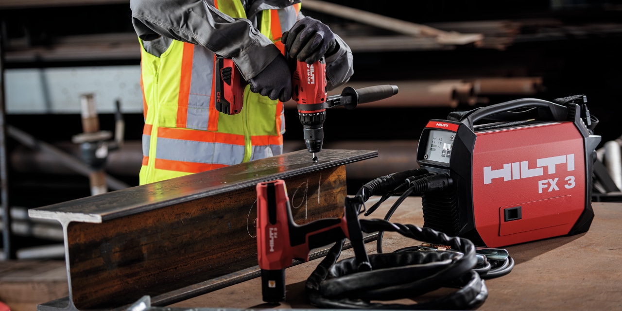 Worker fusing stud to steel with the FX 3-A